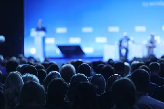 person speaking at a business conference