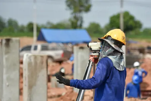 surveyor engineer working at a construction site