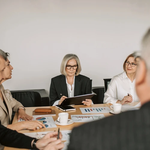 Executives and shareholders at business meeting in office