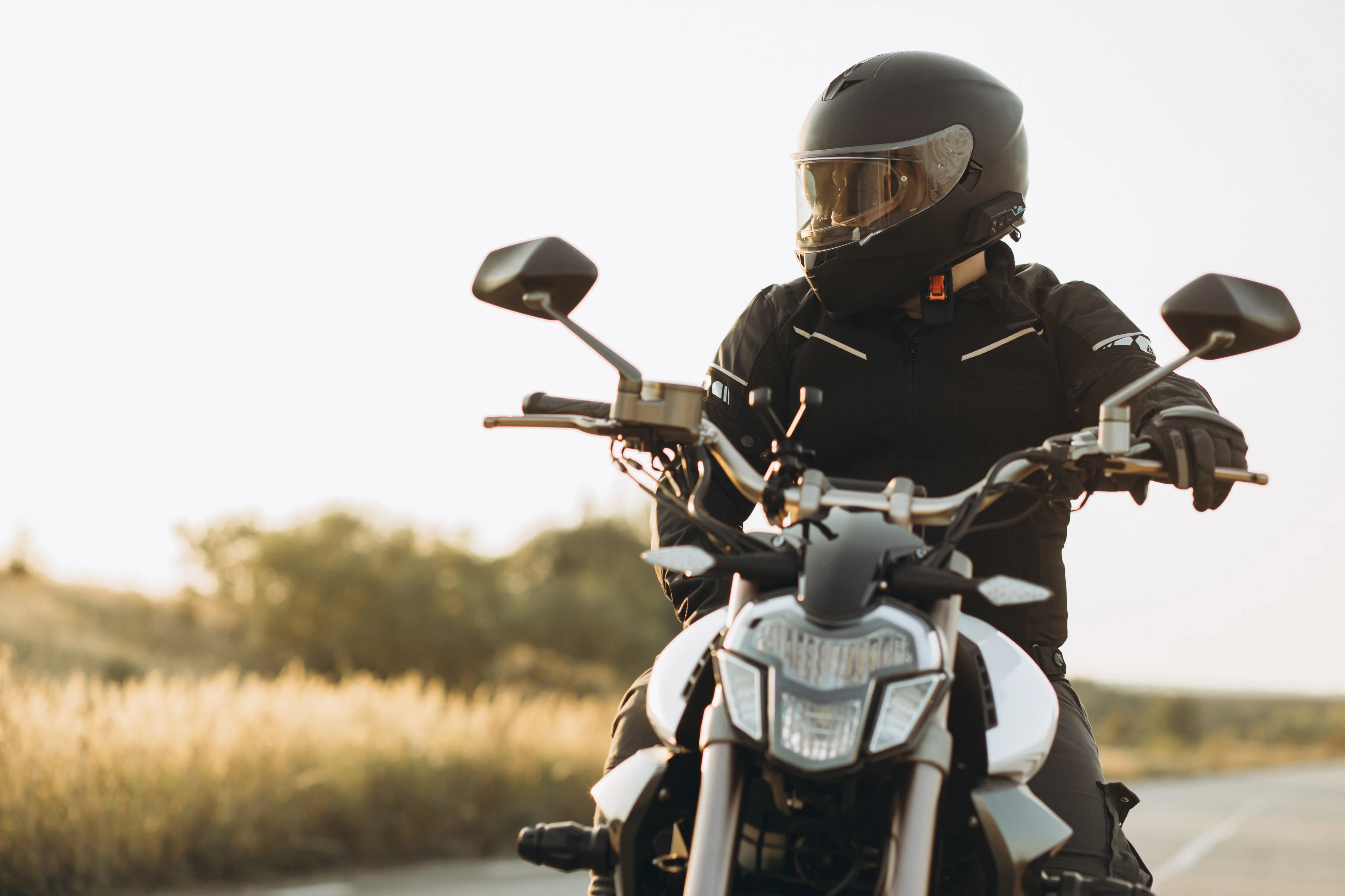 Man biker riding his motorbike on highway